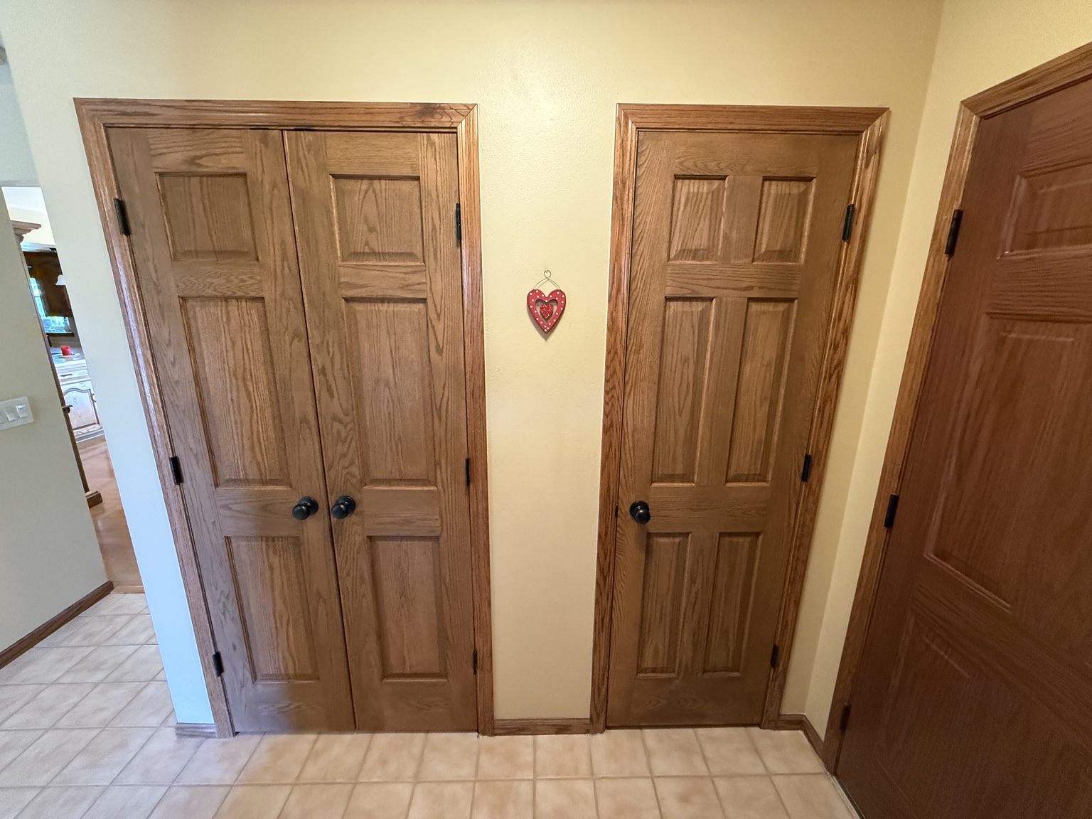 Two wood interior doors with matching casing and dark handles